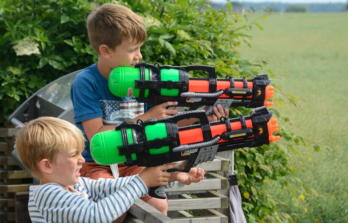 two-boys-6-and-8-years-old-playing-with-toy-guns-sweden-europe-ibljon04385879-jpg